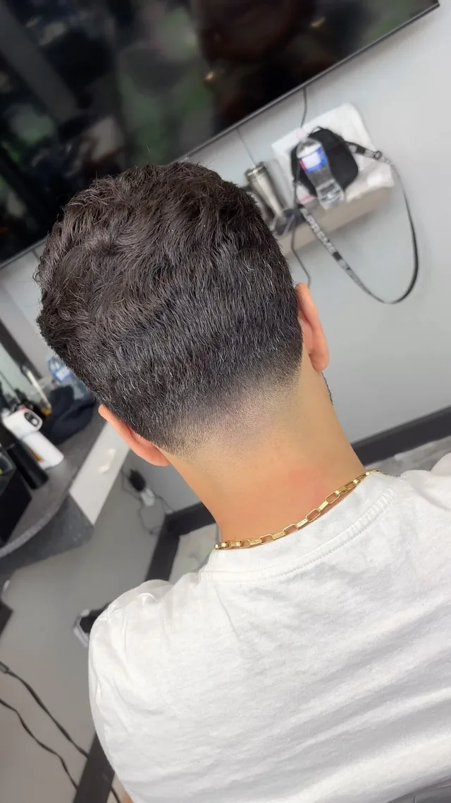 Back view of a textured cut with a low taper at the neckline